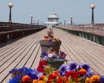 Clevedon Pier with colourful flowers on the walkway