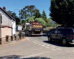 Banwell street with a car and a works truck driving by