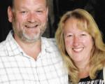 foster carers, Nick and Fran smiling towards the camera
