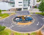 roundabout with electric cars charging in the centre