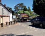 Banwell street with a car and a works truck driving by