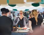 woman buying food at a market stand