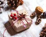 Christmas gift wrapped in brown paper and red ribbon