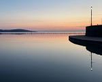 still water at Weston's Marine Lake against a pastel sunset