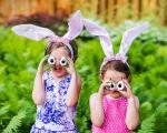 two young girls wearing bunny ears and googly eyes