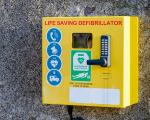 A defibrilator on a wall