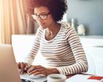 a woman looking at a computer