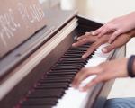 close up of someone playing piano