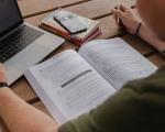 person looking in a book