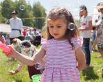 young girl playing with bubbles