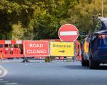 This image shows a picture of a road being closed