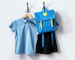 This image shows a picture of school uniform and bag