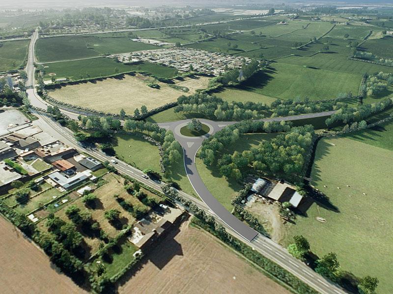 aerial view of fields with a roundabout and three roads