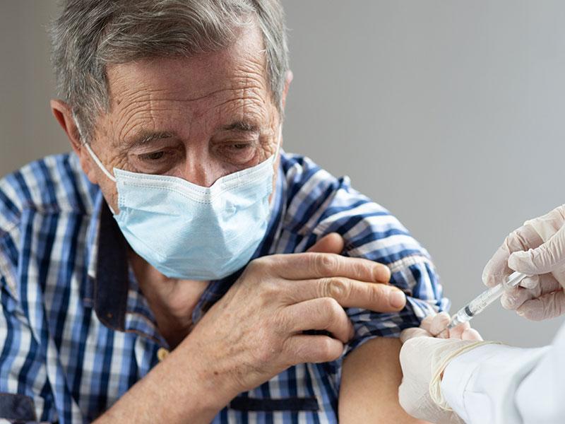 An older person getting a vaccine