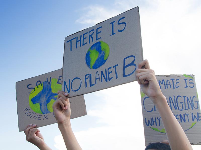 Climate action protestors with No Planet B sign