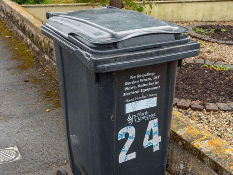 a black waste bin