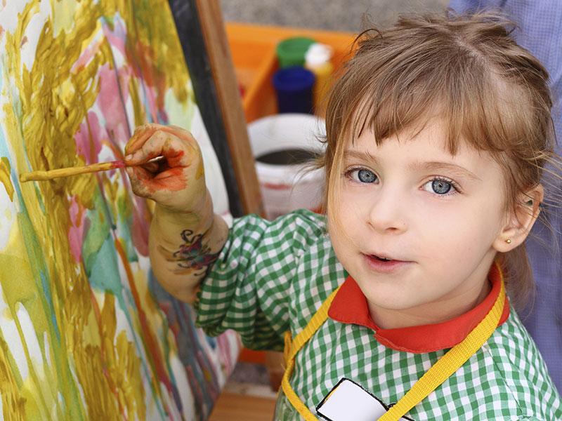 A young girl painting