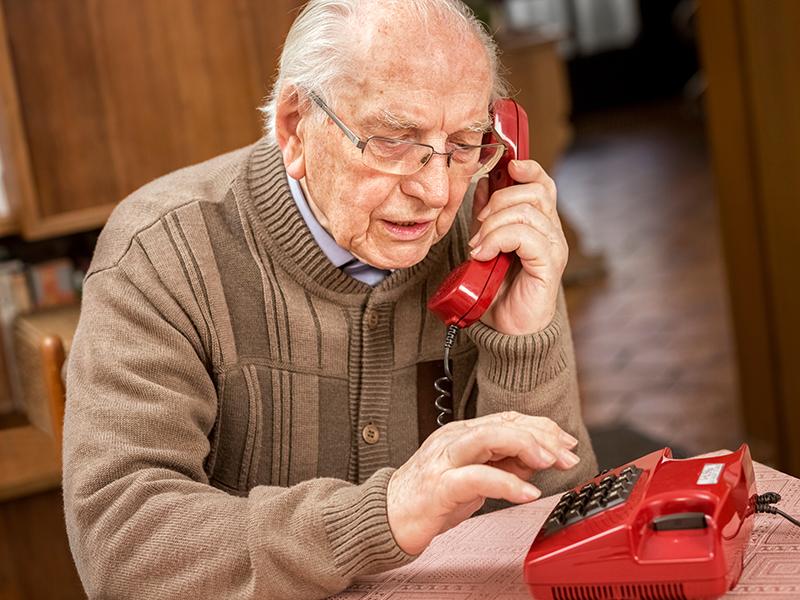 a pensioner making a telephone call