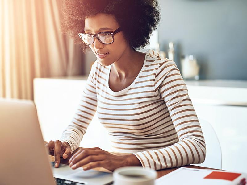 a woman looking at a computer