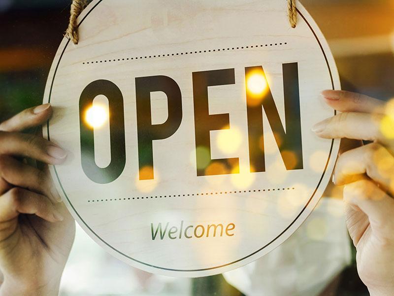 an open shop sign