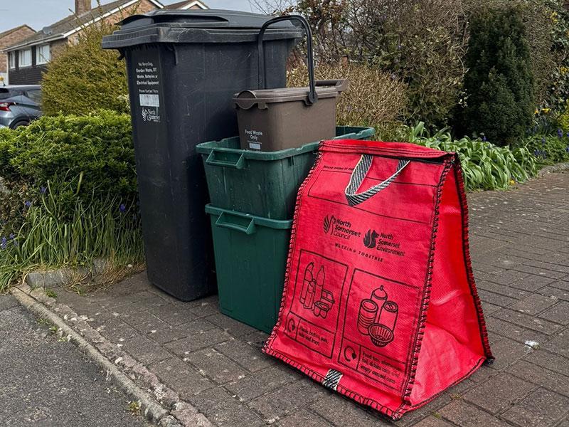 black bin, recycling box and red bag