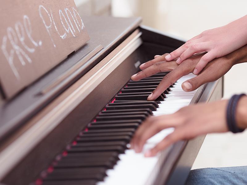 close up of someone playing piano