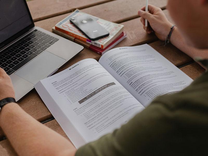 person looking in a book