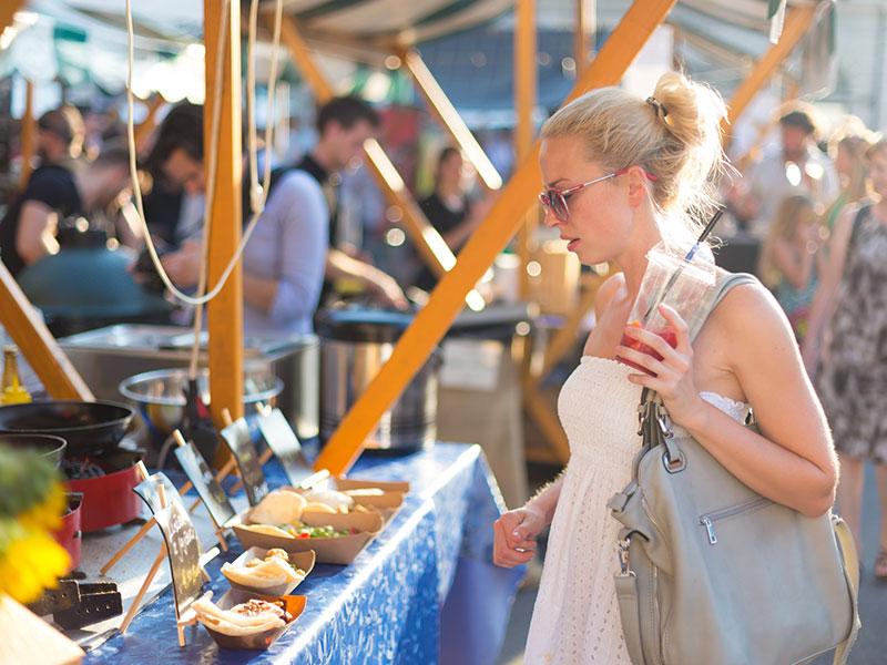woman looking at a market stall