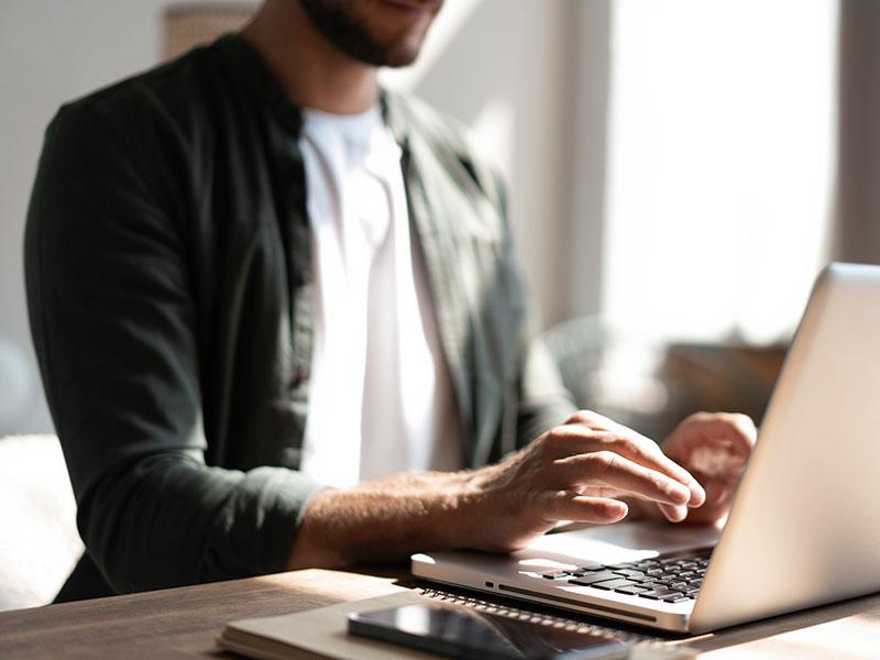 This shows a man using a computer