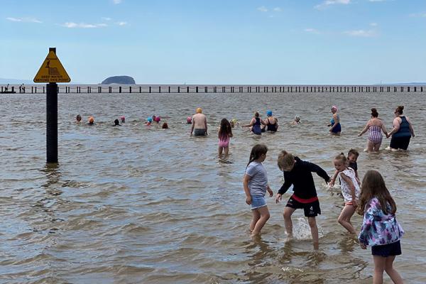 people playing in the sea at Marine Lane in Weston-super-Mare