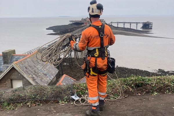 A man in high vis at Birnbeck Pier