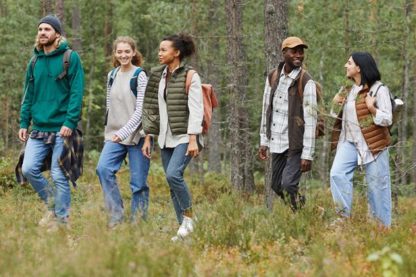 people walking in woods