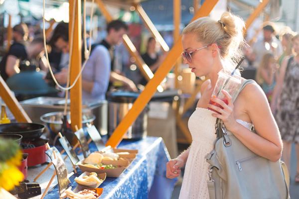 woman looking at a market stall