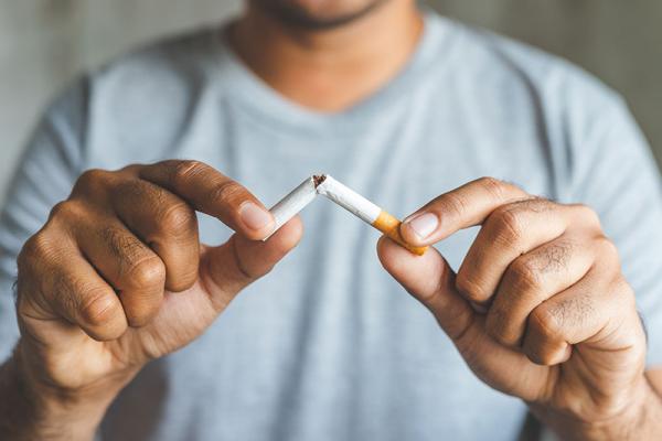 This image shows a photo of someone stopping smoking