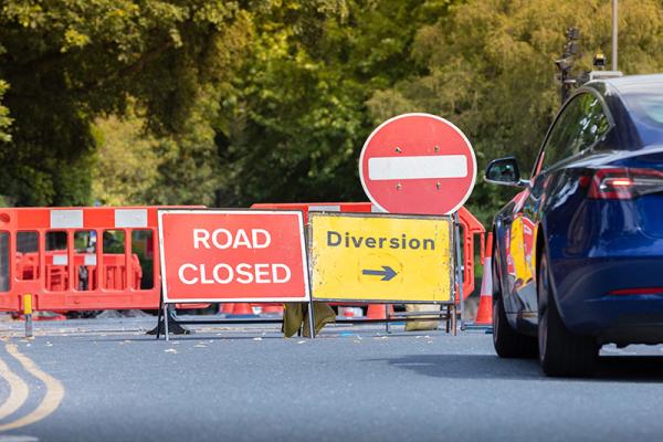 This image shows a picture of a road being closed