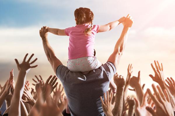 This image shows a picture of people enjoying an outdoor event