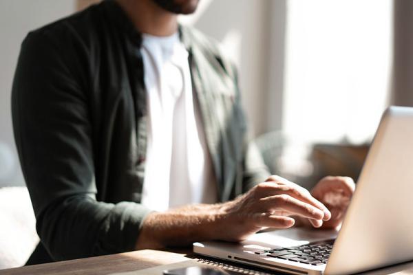 This shows a man using a computer