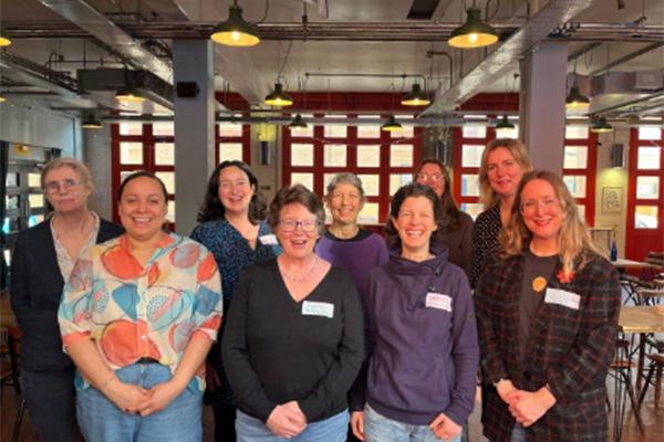 group of people from a community organisation smiling