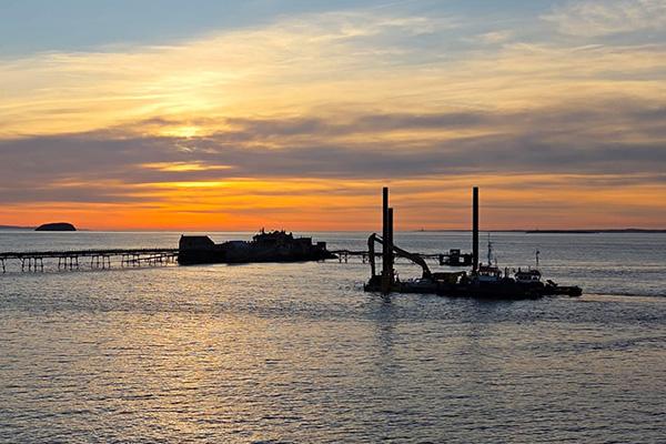 This shows Birnbeck Pier at sunset